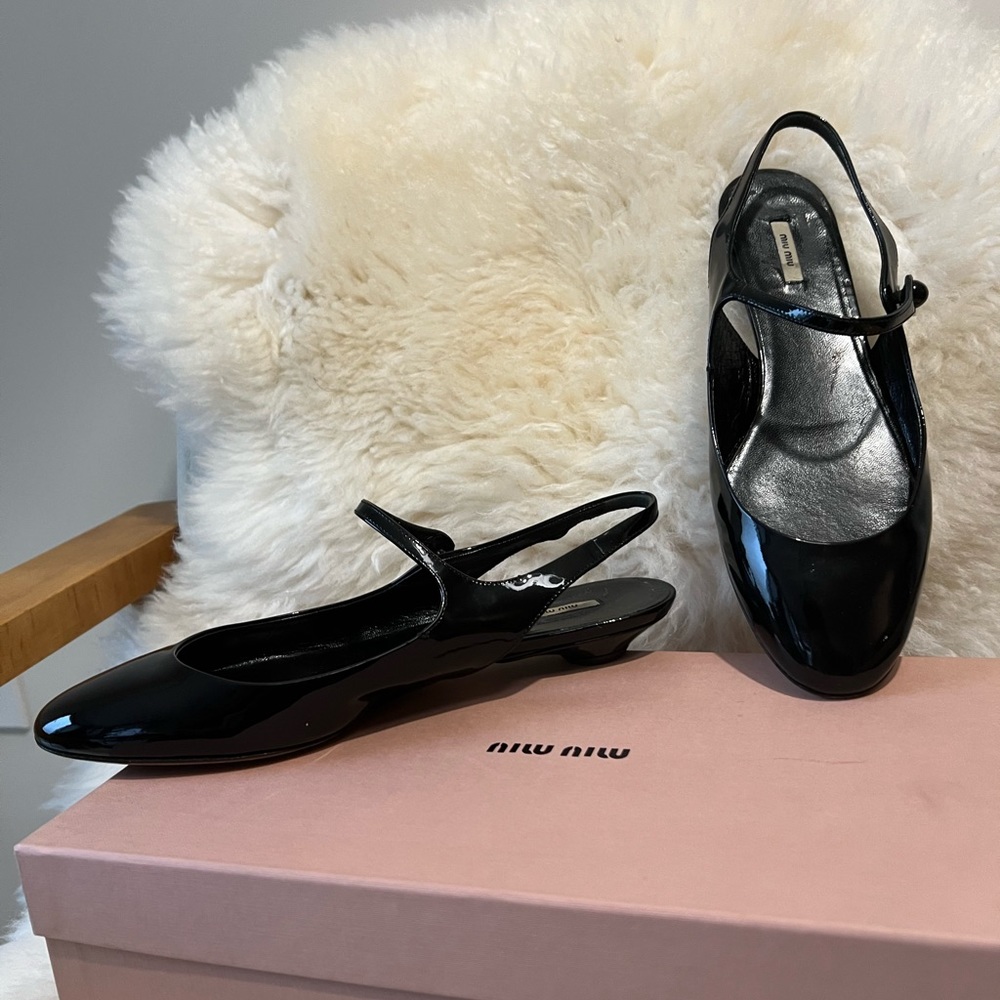 Patent black miu miu flats in size 37